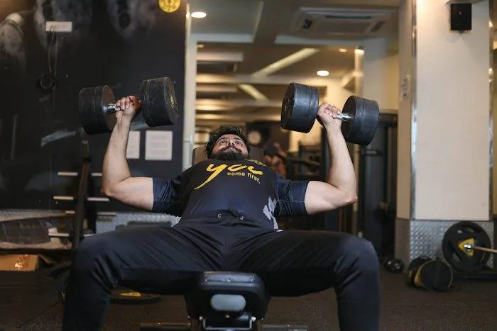 Member doing a dumbbell chest press